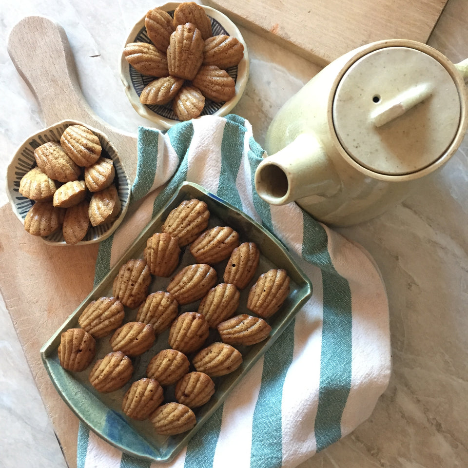 Jenni Oh Crafts ceramic tableware filled with homemade apple and cinnamon madeleines. 